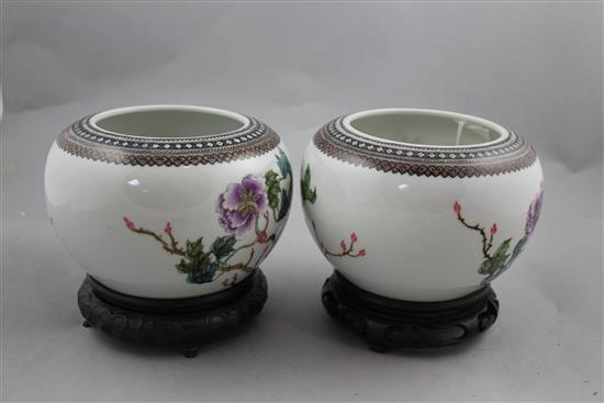 A pair of Chinese famille rose globular bowls, Qianlong marks, Republic period, 16.5cm diam, stands